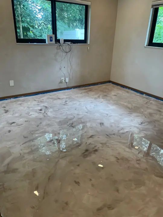 Beige metallic epoxy floor in a room inside a home in Fort Lauderdale, FL