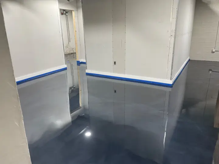 Deep blue black metallic epoxy floor in a hallway in Fort Lauderdale, FL