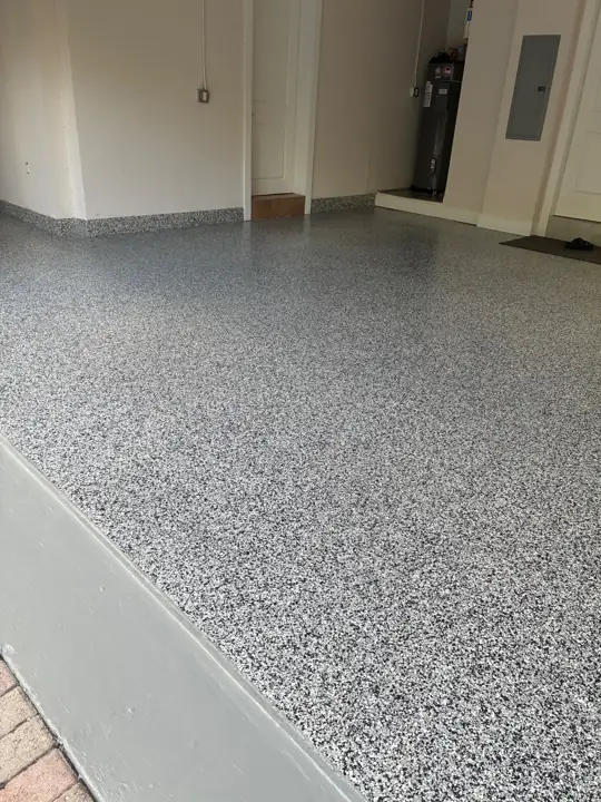 Flake epoxy garage floor running up the step in Fort Lauderdale, FL
