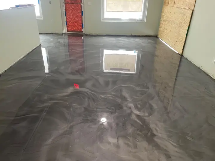 Gray metallic epoxy floor in a room during a remodel in Fort Lauderdale, FL