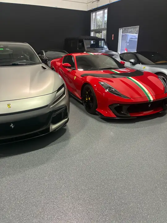 Gray flake epoxy floor in a luxury car garage in Fort Lauderdale, FL